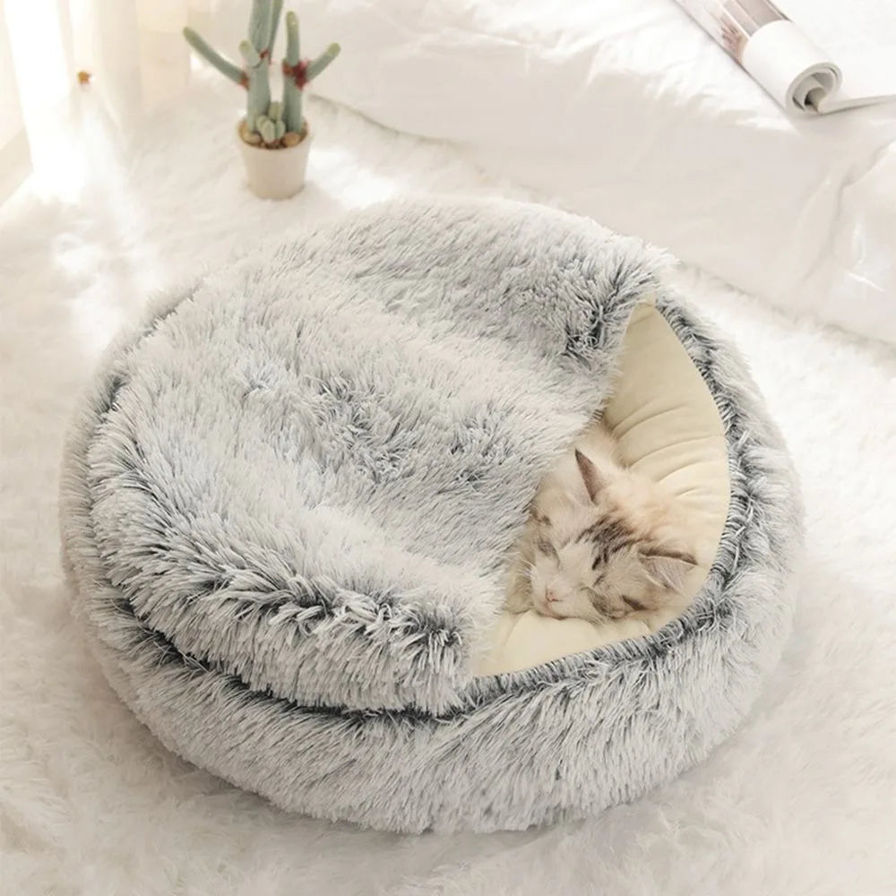 Cat sleeping in white cozy cloudy pet bed