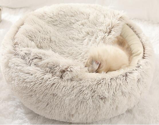 Dog sleeping in white cloud pet bed