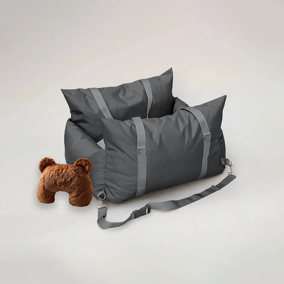 Charcoal grey dog car seat and brown u shaped pet calming pillow